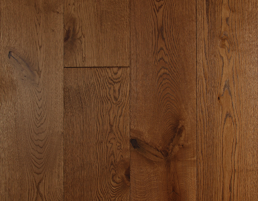 Overhead shot of a dark oak engineered plank floor showing its large and small knots, splits and rich natural colour variation.