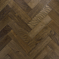 Close up of aged solid oak herringbone parquet floor by Broadleaf Timber.