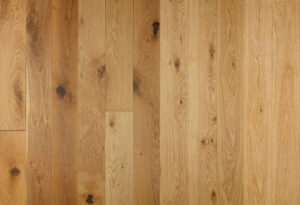 A selection of wooden flooring planks showing various wood grading.