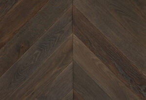 Dark coloured chevron patterned hardwood flooring by Broadleaf Timber.