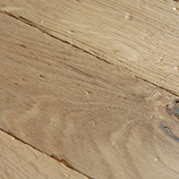 Surface texture on parquet blocks with visible grain.