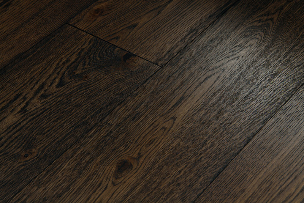 Dark oak plank flooring with visible grain, large knots and colour variation.